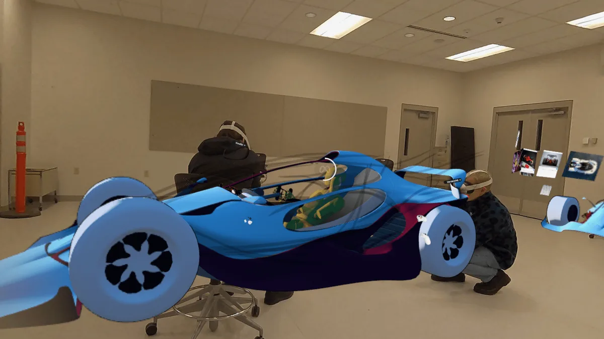 Yoshi and me sculpting the car at full scale.