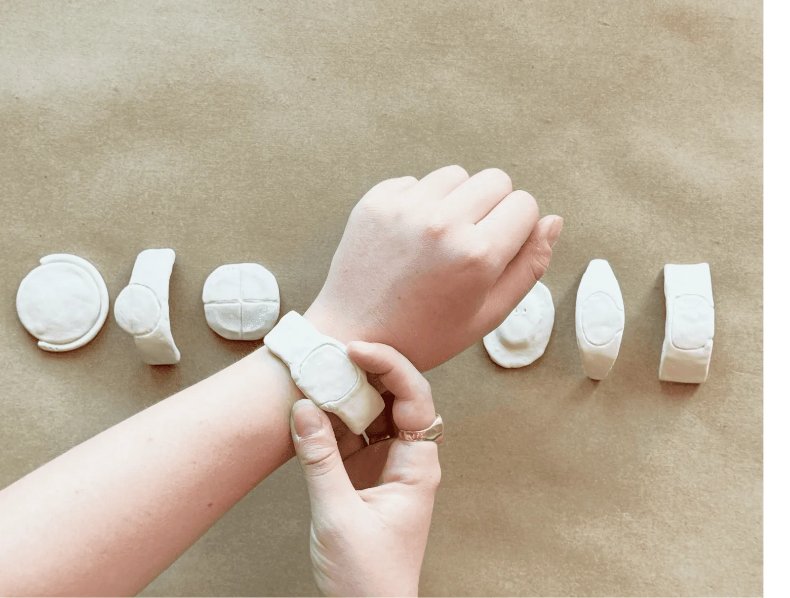 Trying the models on the wrist to feel how each shape sits and grips.